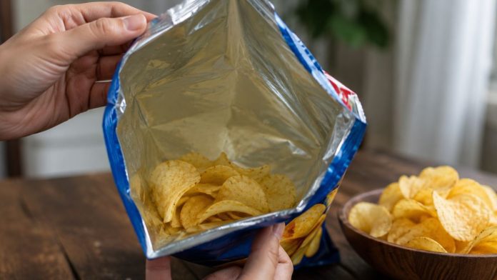 Bag of chips on wooden table