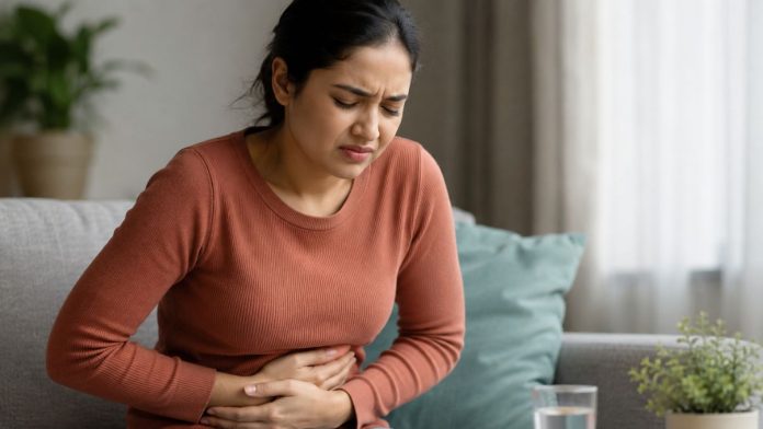 Woman in discomfort on sofa